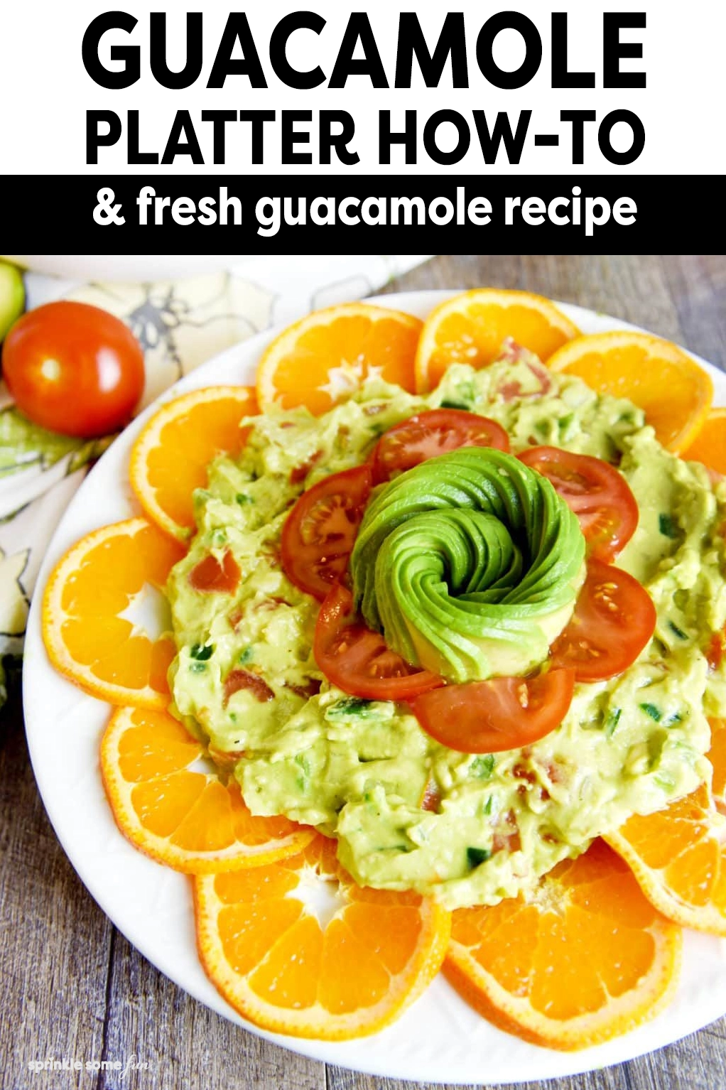 Guacamole platter presentation with guacamole, citrus and tomatoes.  Great for a cinco de mayo party. 